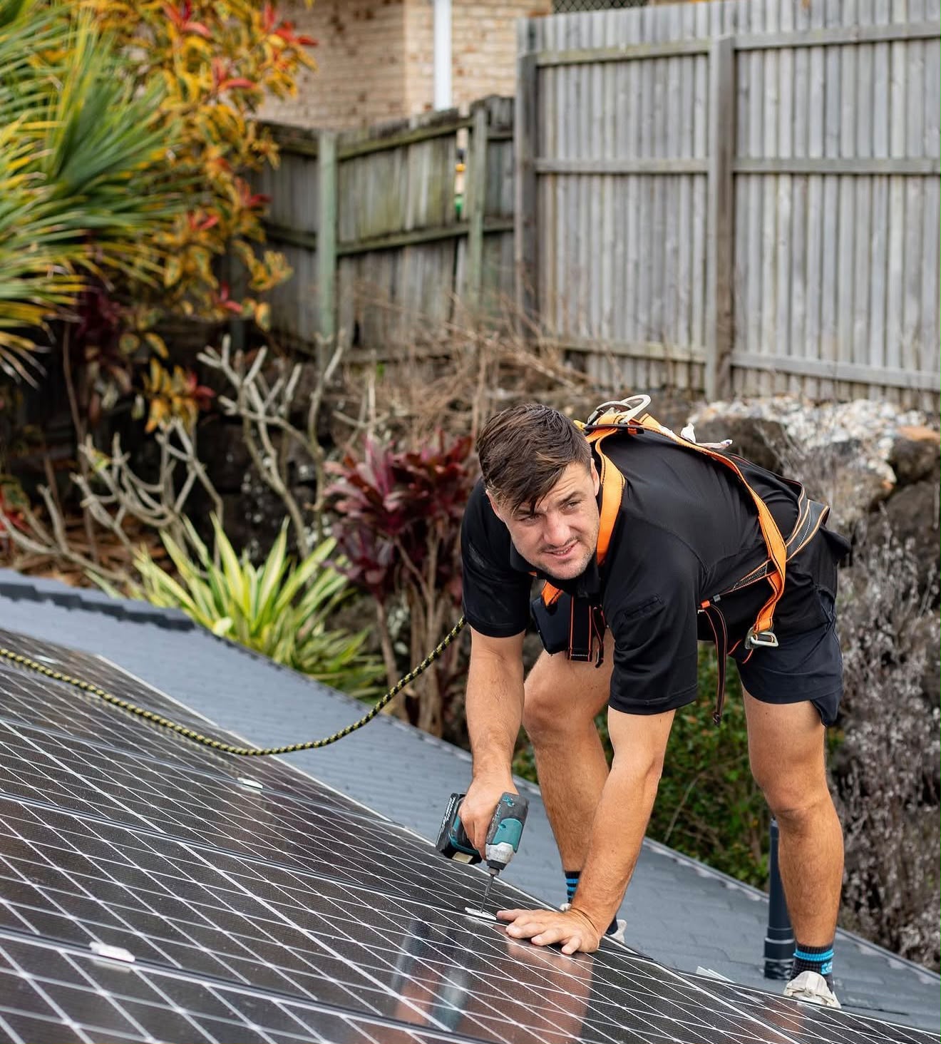 Smart Solar Group installer fitting solar panels on a roof